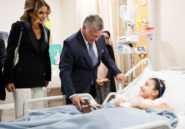 Their Majesties King Abdullah and Queen Rania check on a patient at the King Hussein Cancer Centre in Amman on Wednesday (Photo courtesy of Royal Court)