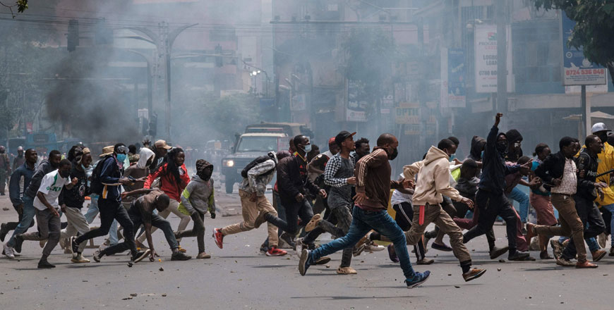 Protesters run from a charge of the Kenya anti-riot police during an anti-government demonstration called following nationwide deadly protests over tax hikes and a controversial now-withdrawn tax bill in downtown Nairobi, on Tuesday (AFP photo)