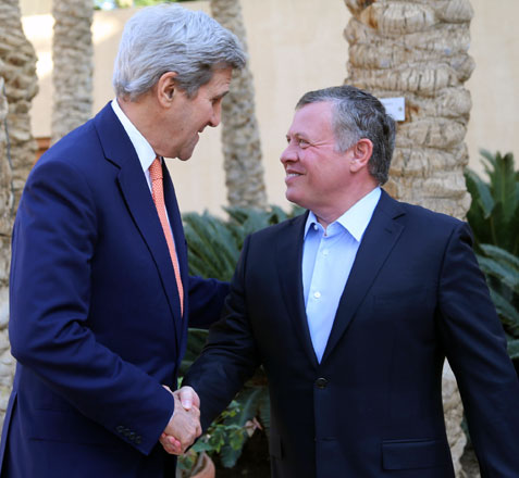 His Majesty King Abdullah greets US Secretary of State John Kerry ahead of their meeting in Aqaba, on Sunday  (Photo courtesy of Royal Court)