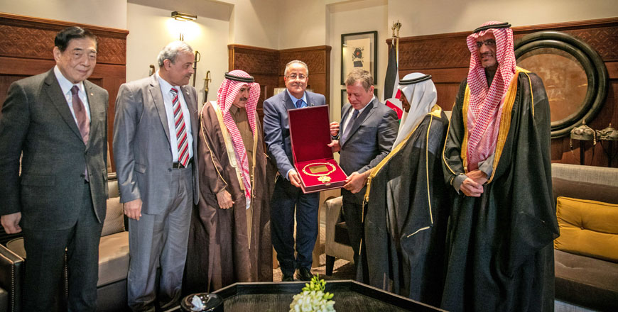 His Majesty King Abdullah accepts a decoration from the Arab Red Crescent and Red Cross Organisation in recognition of His Majesty's humanitarian efforts in Amman on Tuesday  (Photo courtesy of Royal Court)