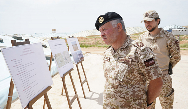 His Majesty King Abdullah and HRH Crown Prince Hussein check on the strategic grain reserves at the Ghabawi horizontal bunker silos on Monday (Photo courtesy of Royal Court)