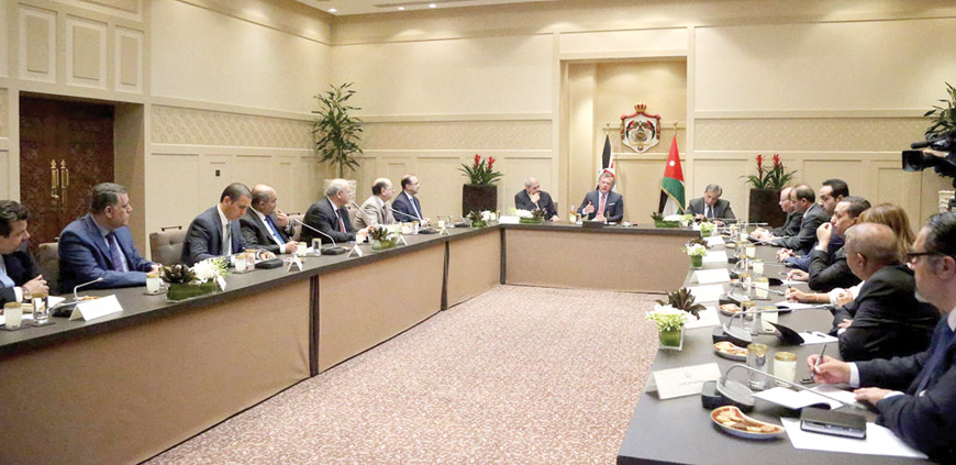 His Majesty King Abdullah meets with former media ministers, directors of official media departments and chief editors in Amman on Wednesday (Petra photo)