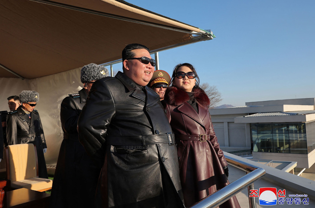 This photo taken on Thursday and released from North Korea’s official Korean Central News Agency (KCNA) via KNS on Friday shows North Korea’s leader Kim Jong-un (centre) and his daughter (right) observing an air festival during a visit with the 1st Air Force Division Flying Regiment of the Korean People’s Army to commemorate Air Day, at an unknown location (AFP photo)