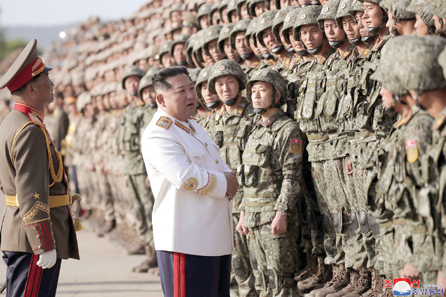 This photo  taken on Thursday and released by North Korea’s official Korean Central News Agency (KCNA) via KNS shows North Korean leader Kim Jong-un (centre) taking part in a parade ceremony to mark the 90th founding anniversary of the Korean People’s Revolutionary Army, at an undisclosed location in North Korea (AFP photo)