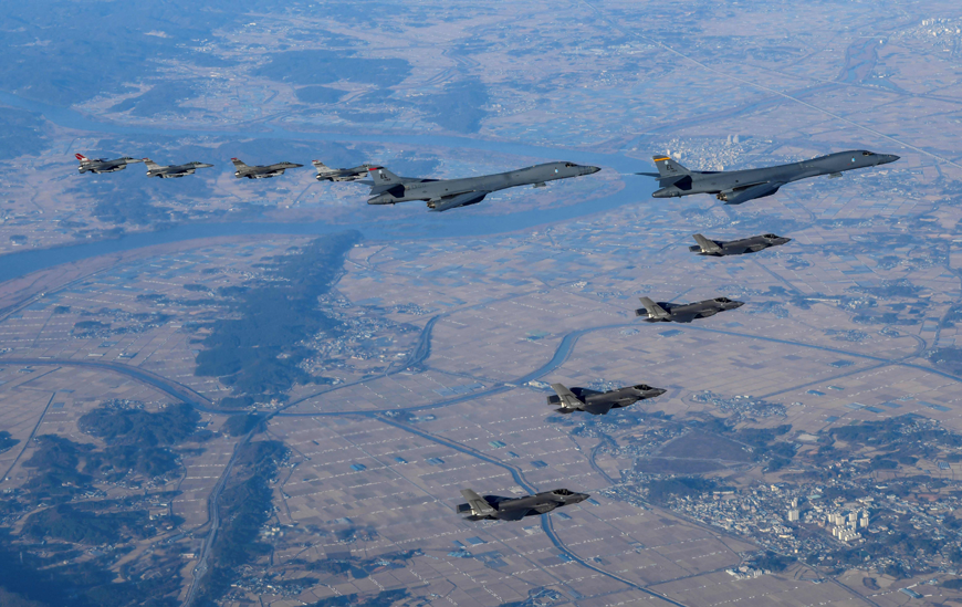 This handout photo taken on Saturday and provided by the South Korean Defence Ministry in Seoul shows two US Air Force B-1B heavy bombers (centre), four South Korean Air Force F-35 fighter jets and four US Air Force F-16 fighter jets flying over South Korea during a joint air drill called ‘Vigilant Storm’  (AFP photo)