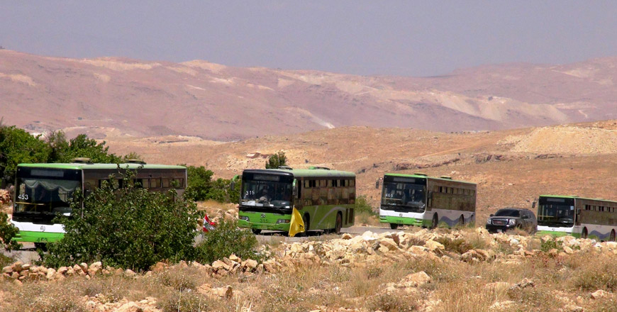 Syrian refugees and members of Ahrar Al Sham, connected with the Free Syrian Army, are seen on the way back to their home country in buses and vehicles after a ceasefire was announced between Hizbollah and a local armed group in Arsal district of Baalbek, Beqaa, Lebanon, on Monday (Anadolu Agency photo)