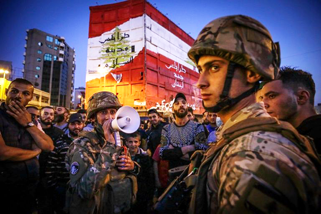 Protesters in Tripoli defied the coronavirus lockdown to mark six months since the start of an anti-government street movement on Friday (AFP photo)
