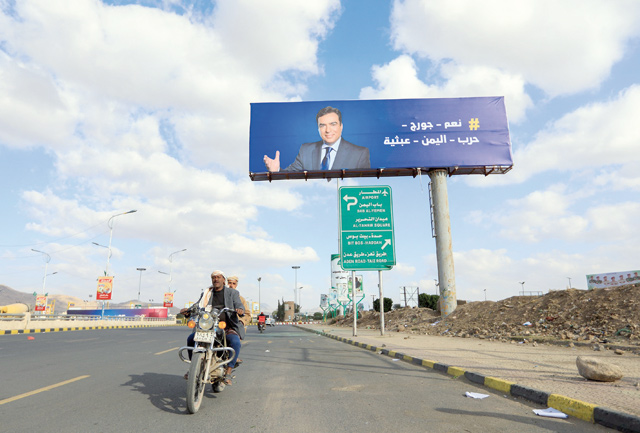 A portrait of Lebanese Information Minister George Kordahi is displayed on a billboard in the Yemeni capital Sanaa on Monday (AFP photo)