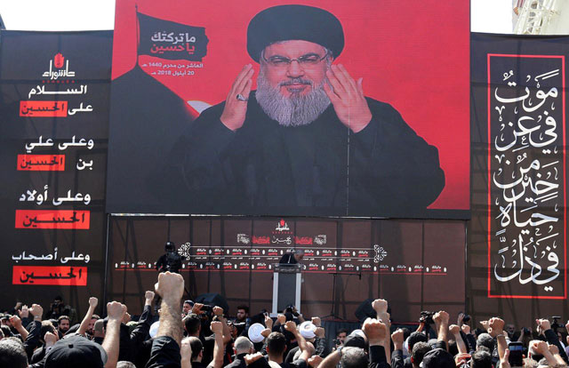 Lebanon’s Hizbollah leader Sayyed Hassan Nasrallah gestures as he addresses his supporters via a screen during last day of Ashura in Beirut, Lebanon, on September 20, 2018 (Reuters photo)
