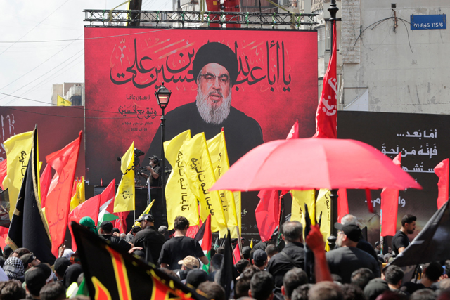 Leader of Lebanon’s Hizbollah Hassan Nasrallah addresses supporters through a giant screen during a rally to mark Ashura, in Beirut’s southern suburb, Lebanon,  Tuesday (AFP photo)