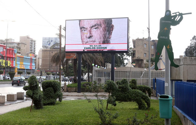 A portrait in support of former Nissan chief Carlos Ghosn is seen on a billboard in a Beirut street on Thursday, following his arrest for alleged financial misconduct on November (Reuters photo)