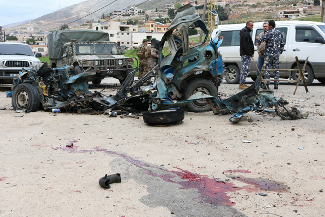 Lebanese soldiers cordon off the site of an Israeli drone attack targeting a vehicle in the town of Souairi, in western Bekaa Valley, Lebanon, on Sunday (AFP photo)