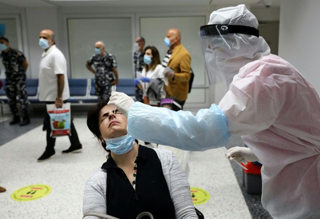 Arriving passengers are tested for coronavirus at Beirut International Airport (AFP photo)