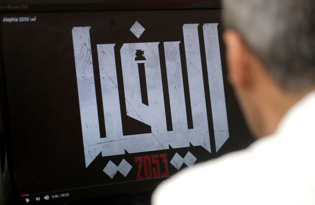 A man watches ‘Alephia 2053’, an Arabic-language animated feature, on YouTube at his office in Beirut, on April 21 (AFP photo)