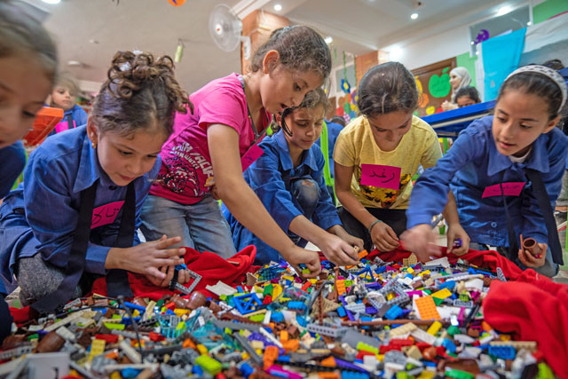 In this undated photo, children play with LEGOs distributed by a partnership between UNICEF and the LEGO Foundation  (Photo courtesy of UNICEF)