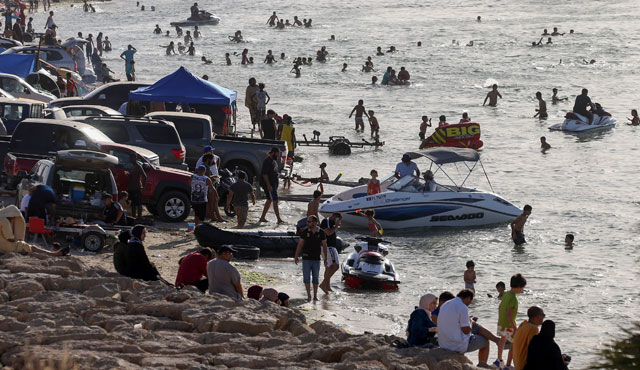 Libyans spend time at the beach in the capital Tripoli on Friday (AFP photo)