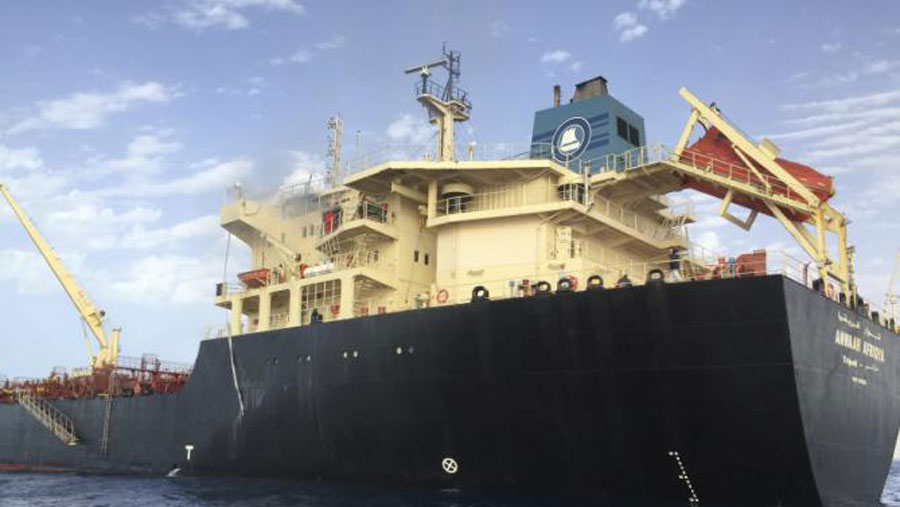 Smoke rises from oil tanker Anwar Afriqya after Libyan warplanes attacked the tanker in Sirte, Libya, on Sunday (Reuters photo)