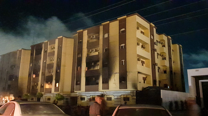 This photo taken early on Saturday shows a view of the building used by Libya’s Tobruk-based parliament building in the country’s east, lit up by protesters who broke inside while demonstrating against deteriorating living conditions and political deadlock  (AFP photo)