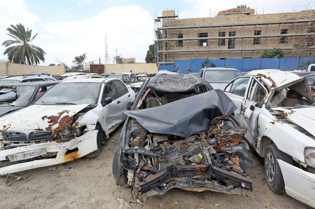 Some of the hundreds of car wrecks, which are stacked at Tariq Al Siqqa, a public park in central Tripoli, are photographed on March 12 (AFP photo)