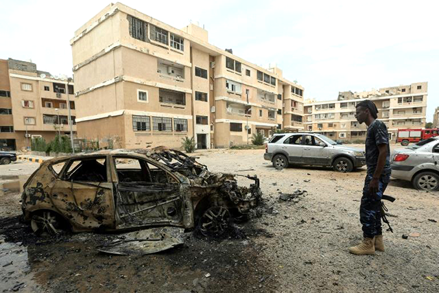 At least four civilians, including a five-year-old girl, were killed and 16 others wounded in the working-class neighbourhoods of Abu Slim and Ben Gashir south of the city (AFP photo)