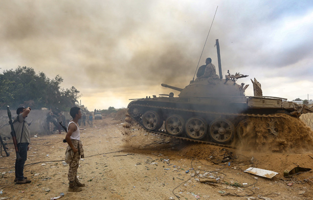 Fighters loyal to the internationally-recognised Libyan Government of National Accord are pictured near the frontline during clashes against forces loyal to strongman Khalifa Haftar in Al Sawani area, south of the Libyan capital Tripoli, on Saturday (AFP photo)