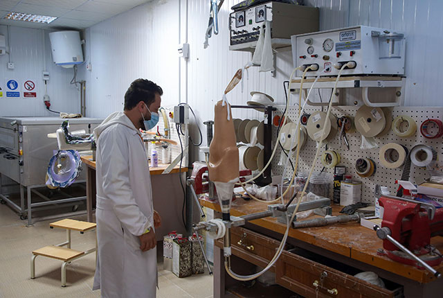 A member of staff works at the National Centre for Artificial Limbs, in Libya's port city of Misrata, on December 17, 2020 (AFP photo)