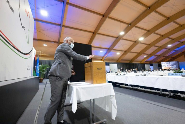 This handout photo taken by the UN shows a delegate casting his vote for the new interim government on Friday  (AFP photo)