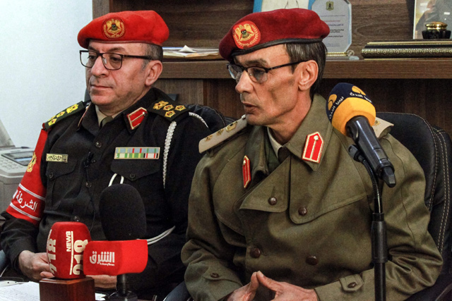 Libyan military police Brig. Gen. Abdel Basset Abu Gharis (left) and Benghazi chief of military prosecution Col. Ali Madi give a joint press conference at the former’s office in Libya’s eastern city of Benghazi on Saturday, briefing reporters about updates regarding the assassination of Mahmoud Al Werfall (AFP photo)