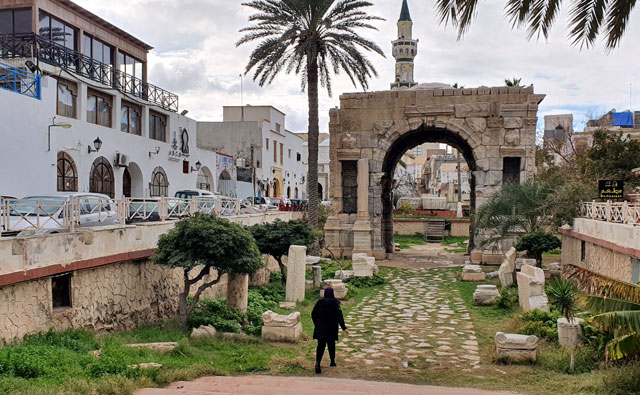 A Libyan woman walks on Tuesday in the Libyan capital Tripoli, controlled by the UN-recognised Government of National Accord (AFP photo)