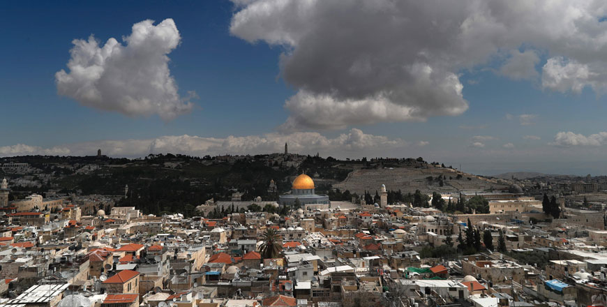 The Dome of the Rock is seen surrounded by houses in Jerusalem’s Old City (foreground) with the Mount of Olives in the background on Thursday (AFP photo)