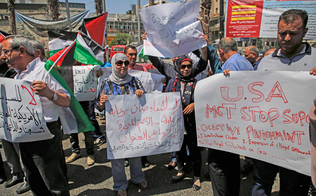 A photo taken on Thursday in the West Bank city of Ramallah shows Palestinian demonstrators protesting against the arrival of a US delegation headed by Senior White House Adviser Jared Kushner to meet with Palestinian President Mahmoud Abbas (AFP photo)