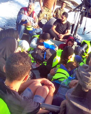 Lebanon’s navy rescuing dozens of people, including Syrians, from a sinking boat off the country’s northern coastal town of Sheikh Zinad, in the Akkar province on Saturday (AFP photo)