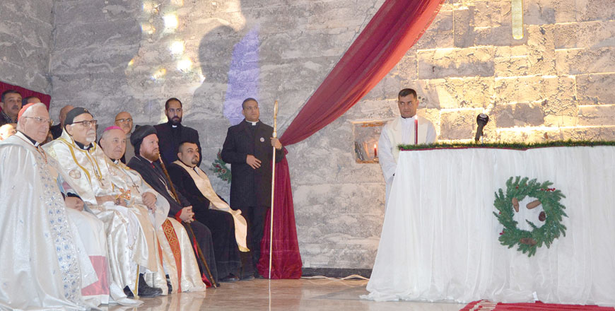 Iraqi clergymen attend a Christmas mass at the Saint Paul’s Church on Sunday in the country’s second city Mosul (AFP photo)