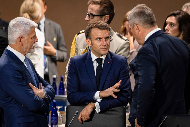 French President Emmanuel Macron (centre) speaks to Iceland's Prime Minister Bjarni Benediktsson (right) and Czech Republic President Petr Pavel  during the NATO 75th anniversary summit at the Walter E. Washington Convention Centre in Washington, DC, on Wednesday (AFP photo)
