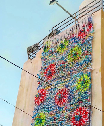 Art work of Maria Nissan on a wall in Amman’s Jabal Al Natheef, using 978 bags, 2,205 bottles, 153 shisha pipes and 70 caps (Photo courtesy of Maria Nissan Instagram account)