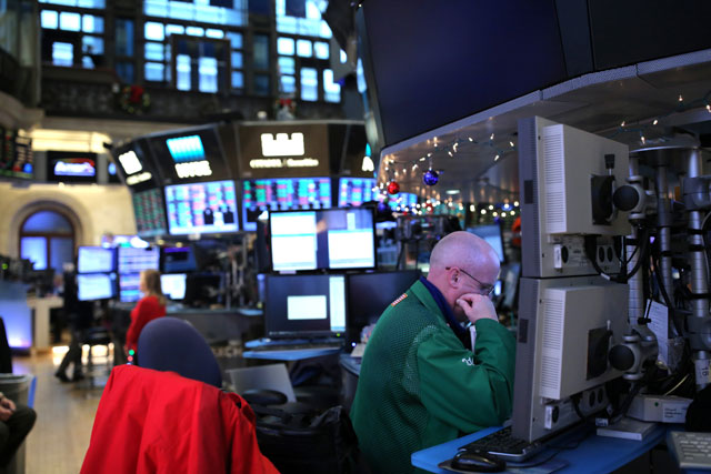 A trader at the New York Stock Exchange in Manhattan, New York City, on Friday (Reuters photo)
