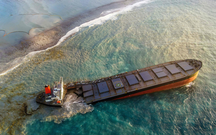 An aerial view taken on Saturday shows the vessel MV Wakashio, belonging to a Japanese company but Panamanian-flagged that had run aground near Blue Bay Marine Park, Mauritius  (AFP photo)
