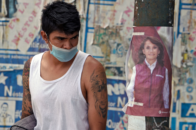 Electoral propaganda of Dolores Padierna, candidate for mayor for the National Regeneration Movement (Morena), is seen on a street post in Cuauhtemoc, Mexico City, on Tuesday (AFP photo)