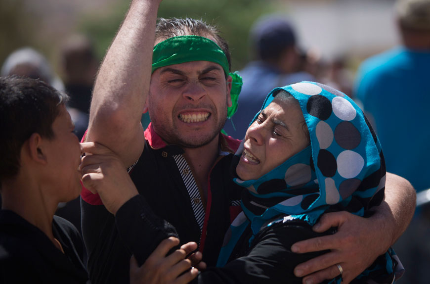 Palestinians mourn the death of Saad Dawabsheh, 32, during his funeral procession in the West Bank village of Duma, near Nablus, on Saturday (AP photo by Majdi Mohammed)