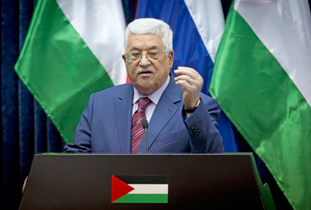 In this November 11, file photo, Palestinian President Mahmoud Abbas speaks during a press conference with Russian Prime Minister Dmitry Medvedev following a meeting in the West Bank city of Jericho (AP photo)