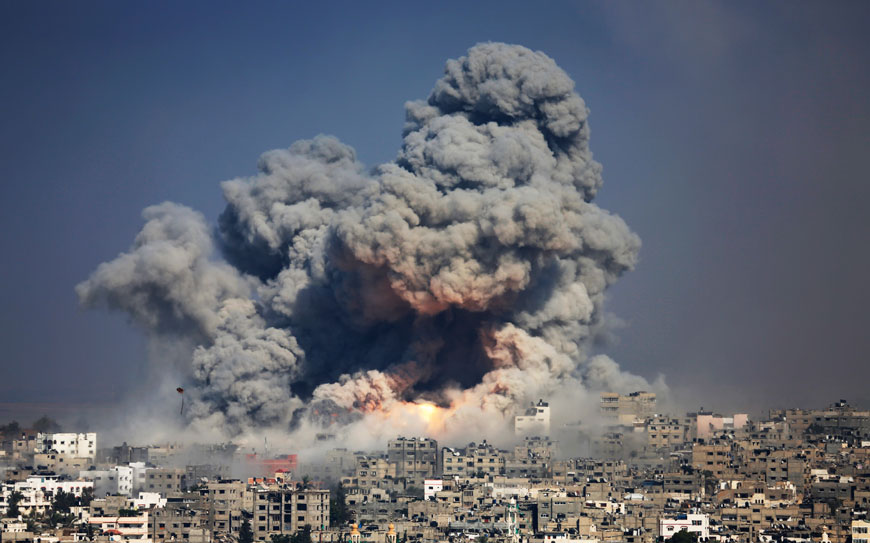 In this July 29, 2014 file photo, smoke and fire from the explosion of an Israeli strike rise over Gaza City (AP photo)