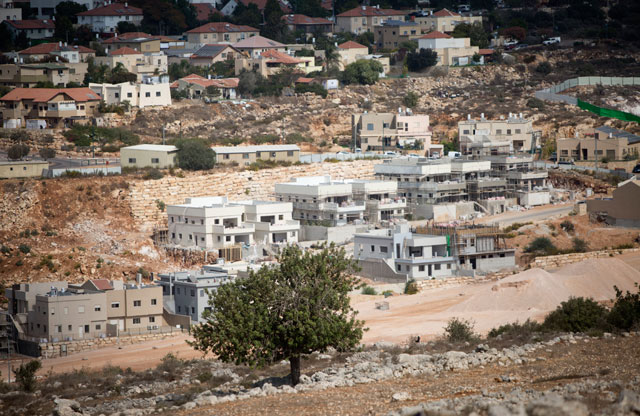 This October 22 photo shows a general view of settlement units in the Israeli Jewish Orthodox settlement of Revava, near the West Bank city of Nablus (AP photo by Majdi Mohammed)