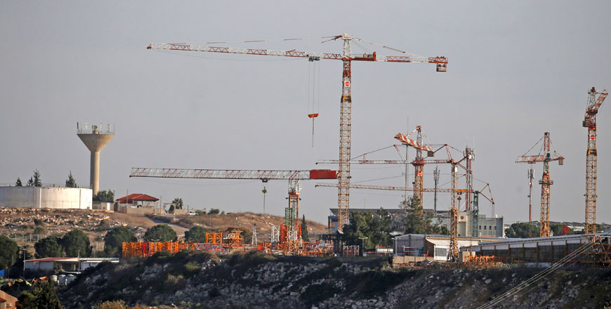 A picture taken on Tuesday from the Palestinian West Bank village of Qarawat Bani Hassan shows the Israeli settlement of Burkan (AFP photo)