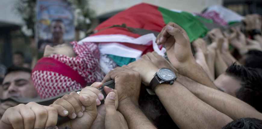 Palestinian mourners carry the body of Moataz Zawahara, 28, who was killed in confrontations with Israeli troops, during his funeral in Deheisha refugee camp, near the West Bank city of Bethlehem, Wednesday (AP photo by Nasser Nasser)