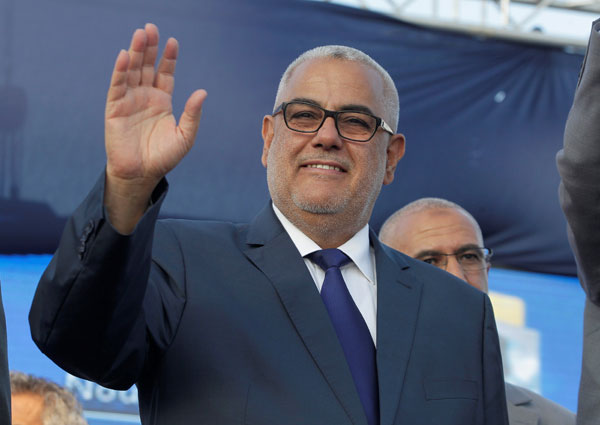 Moroccan Prime Minister Abdelilah Benkirane,  secretary general of the Justice and Development Party, waves during a party meeting in Rabat, Morocco, on Thursday (Reuters photo)