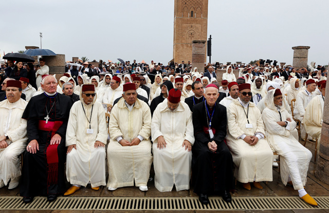 Members of the clergy watch as Pope Francis and King Mohammed VI of Morocco visit the Hassan Tower esplanade in Rabat, Morocco, on Saturday (Reuters photo)