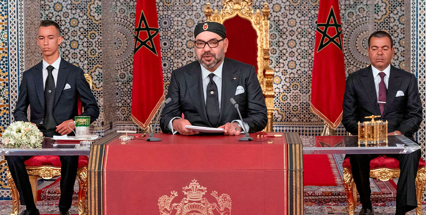 This handout photo provided by the Moroccan Royal Palace on Monday shows Morocco's King Mohammed VI (centre) delivering a speech marking the 20th anniversary of his accession to the throne, with his brother Prince Moulay Rachid (right) and son Prince Moulay Hassan seated alongside him, in the northern city of Tetouan (AFP photo)