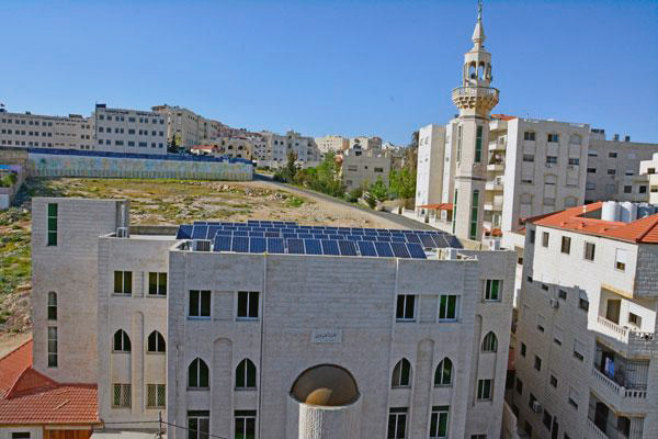 Solar panels are seen on the roof of a mosque in Amman in this file photo (Photo by Amjad Ghosoun)