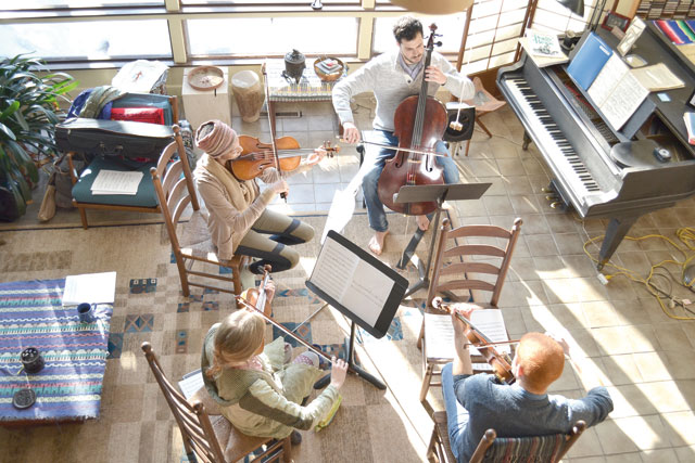The four musicians from Jordan, Palestine, the US and the UK rehearse together in Boston recently (Photo courtesy of Nathalie Botbol)