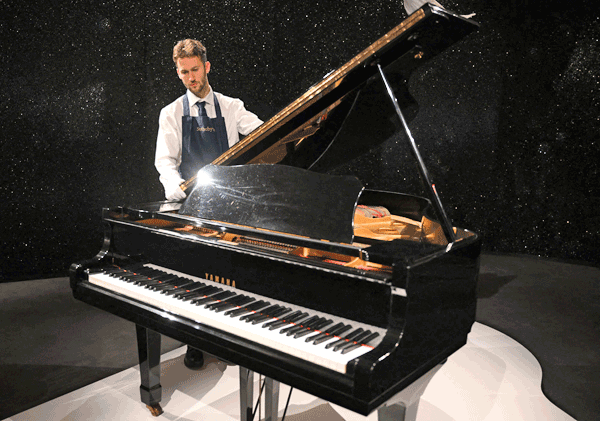 Freddie Mercury’s Yamaha G-2 baby grand piano is pictured during a press preview ahead of the ‘Freddie Mercury: A World of His Own’ auctions, at Sotheby’s auctioneers in London on August 3 (AFP photo)